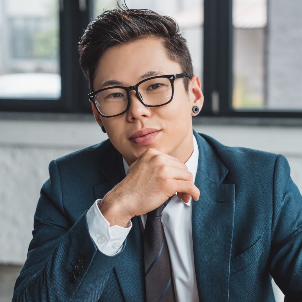 Handsome Young Asian Businessman In Suit And Eyegl QNR7Z5E 1